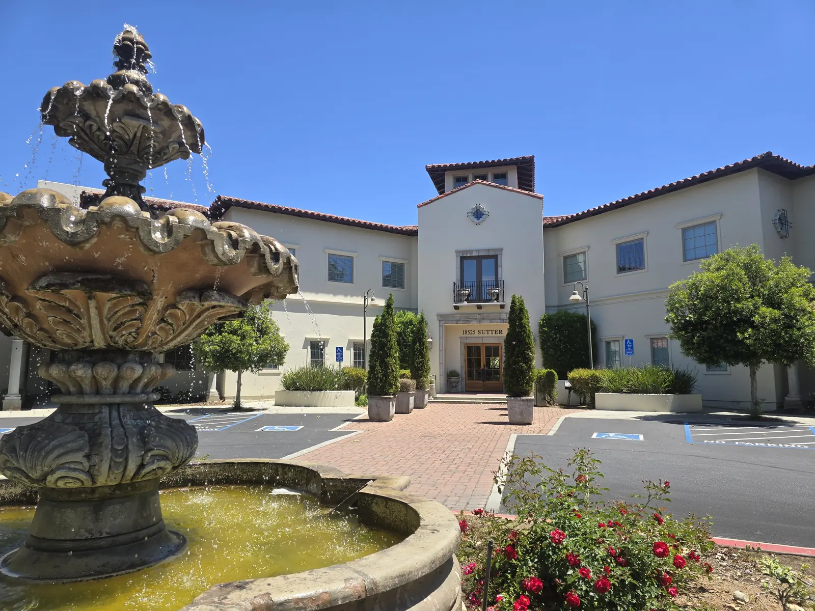 The MC Insurance Services office at 18525 Sutter Boulevard, Morgan Hill, California, with a fountain in the courtyard