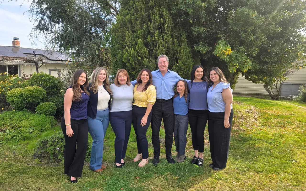 The MC Insurance Services team together outdoors in Morgan Hill, California